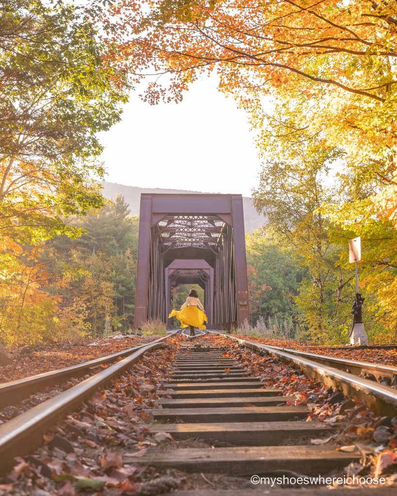 new england fall road trip - foliage and train tracks