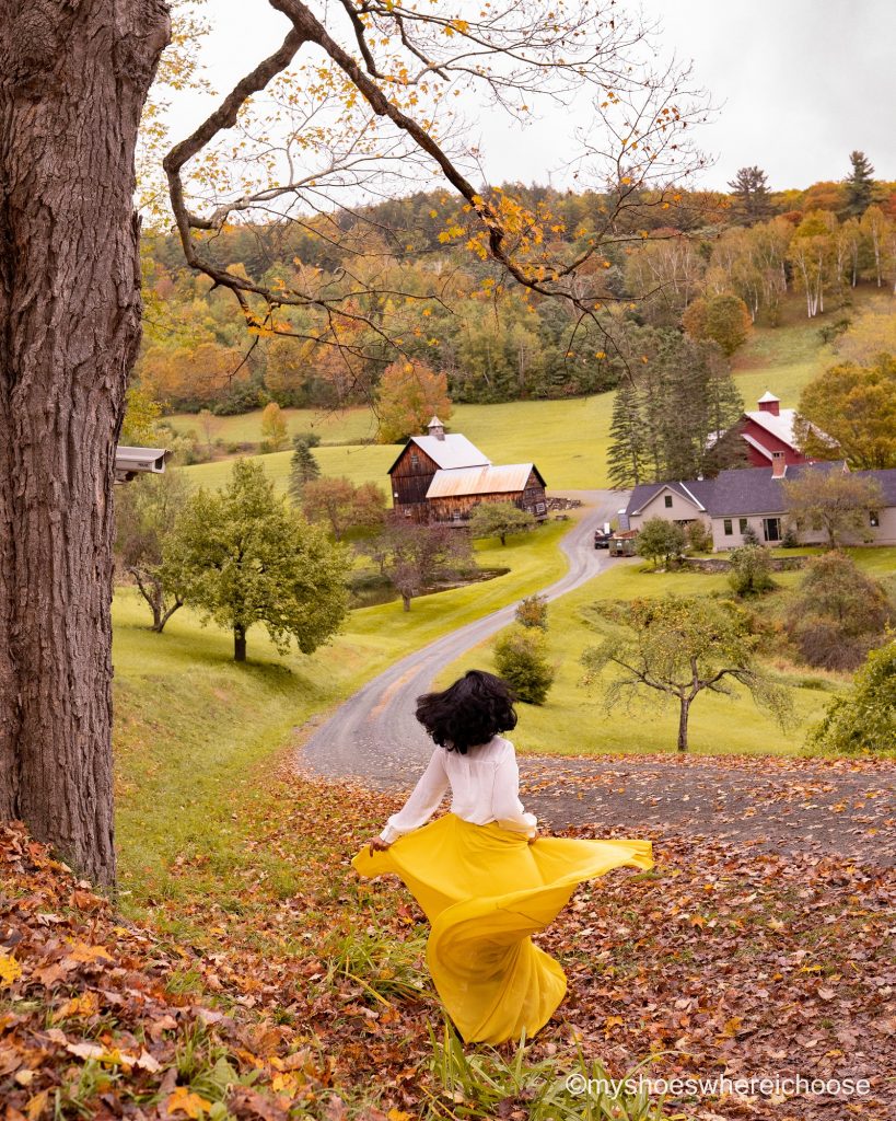 Girl dancing with Sleepy Hollow Farm Vermont in the background during Fall