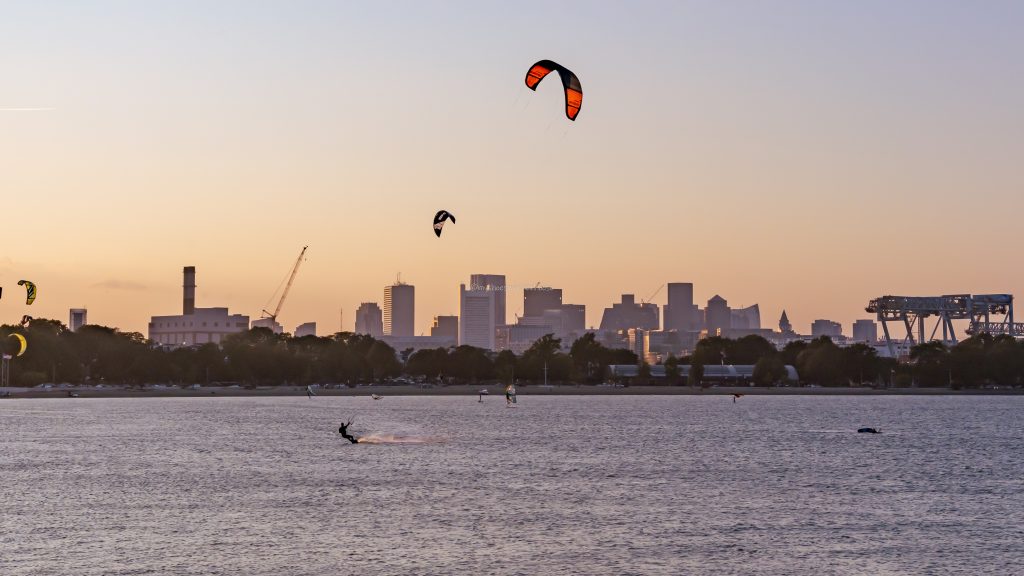 Boston skyline view and kitesurfers from castle island